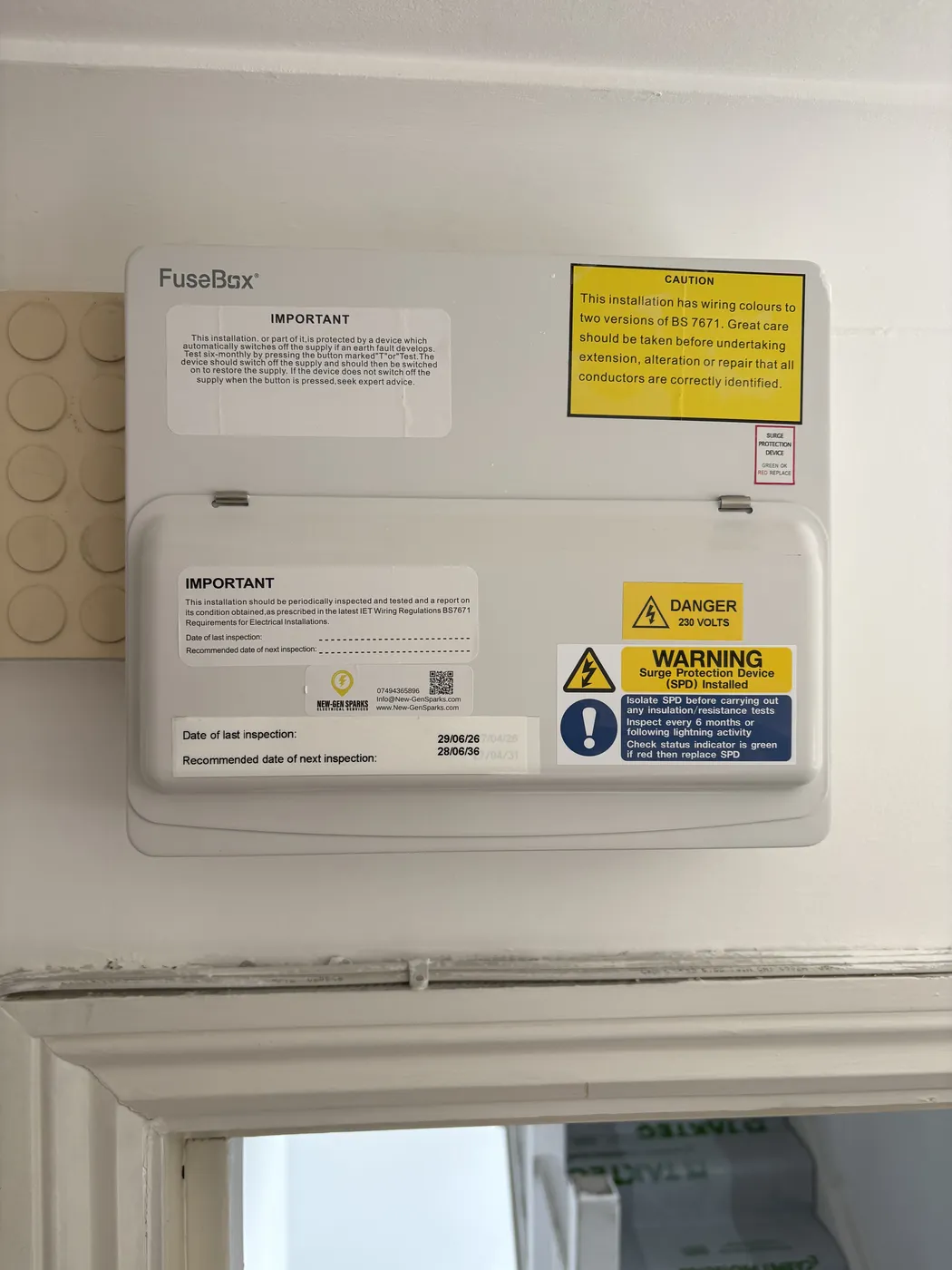 Consumer unit after an EICR in White City with inspection date labels fitted