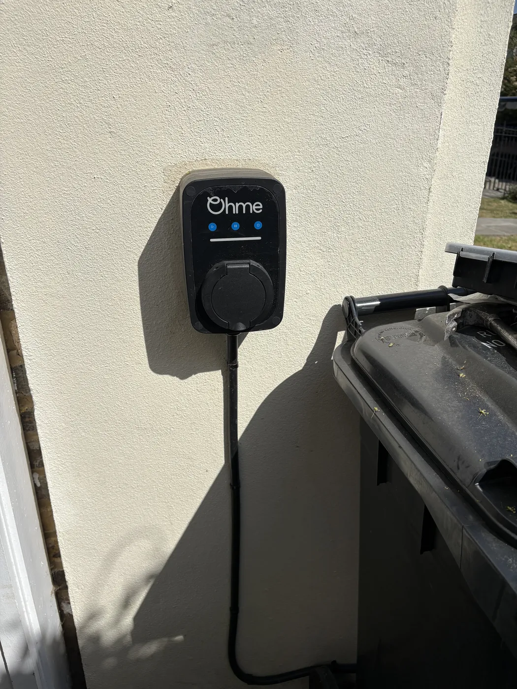 Ohme home EV charger installed on an exterior wall in Chiswick