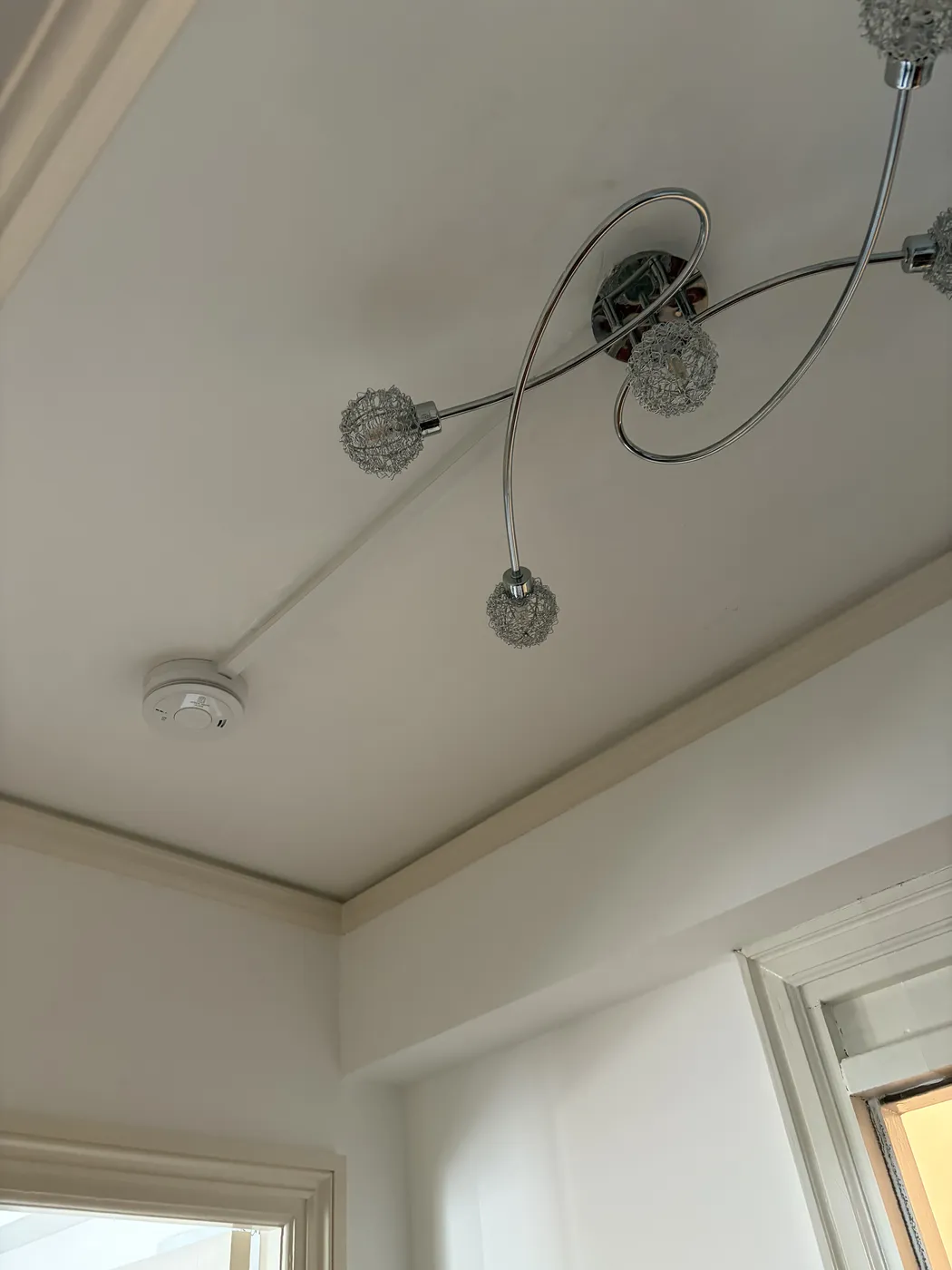 Decorative ceiling light and smoke alarm installed in a Fulham hallway