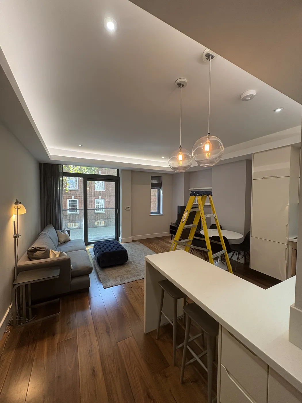 LED coving, downlights and feature pendants in an open-plan Bayswater flat