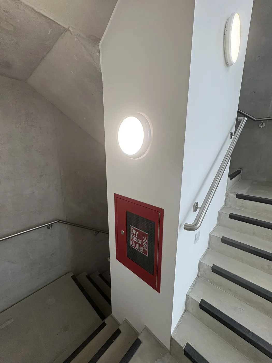 LED bulkhead lights installed in a Notting Hill communal stairwell
