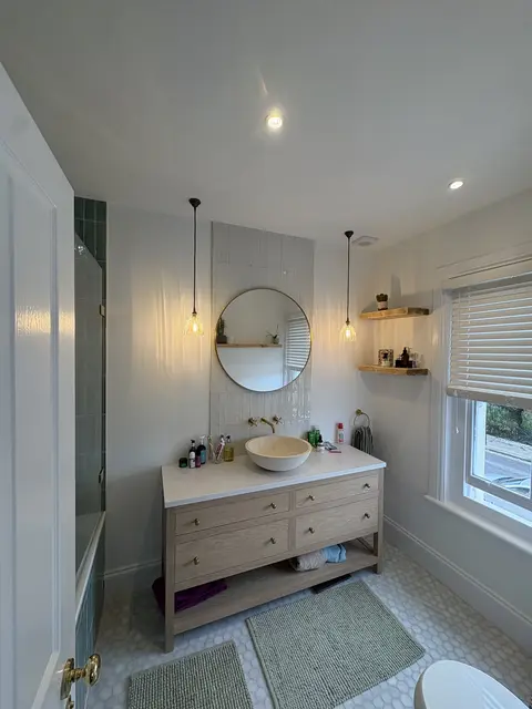 Finished Chiswick bathroom with downlights, twin pendants and oak vanity