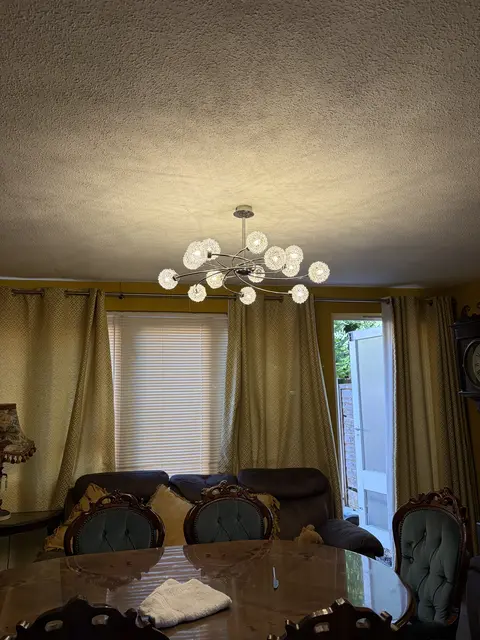 Chrome multi-arm chandelier fitted in a Paddington dining room