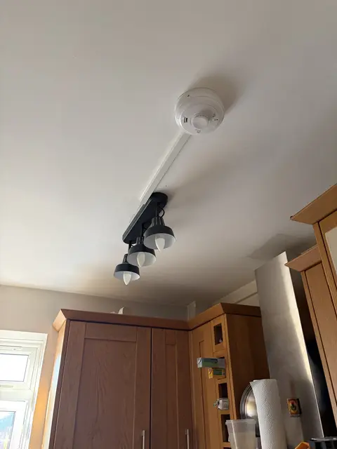 Three-head spotlight bar and heat alarm installed in a Fulham kitchen