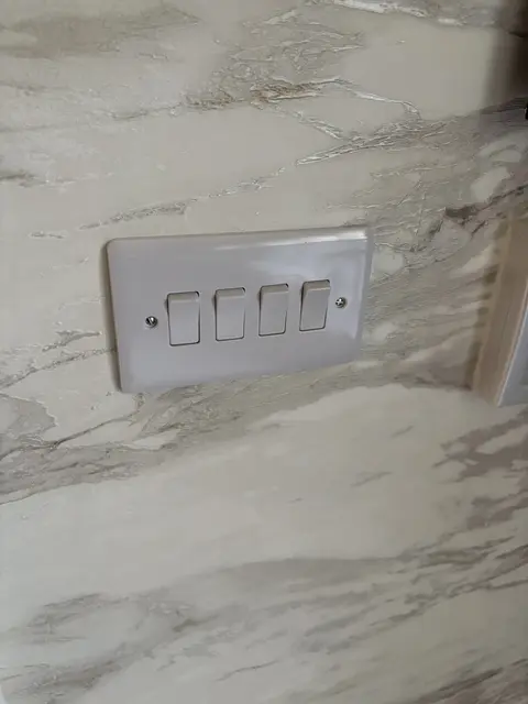 Four-gang light switch neatly installed in Maida Vale