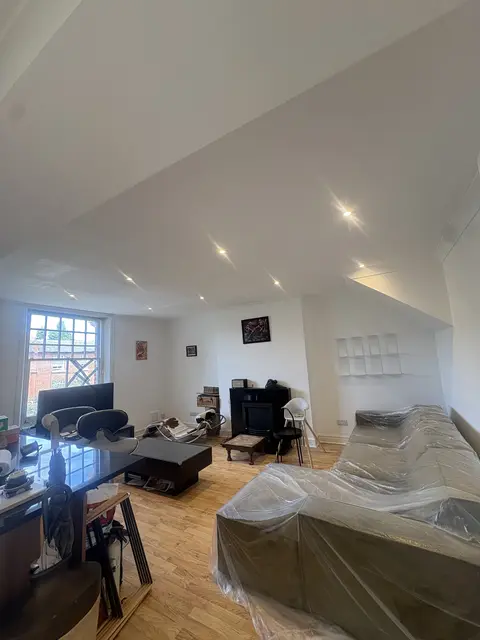 New recessed downlights lit in a refurbished Chiswick living room