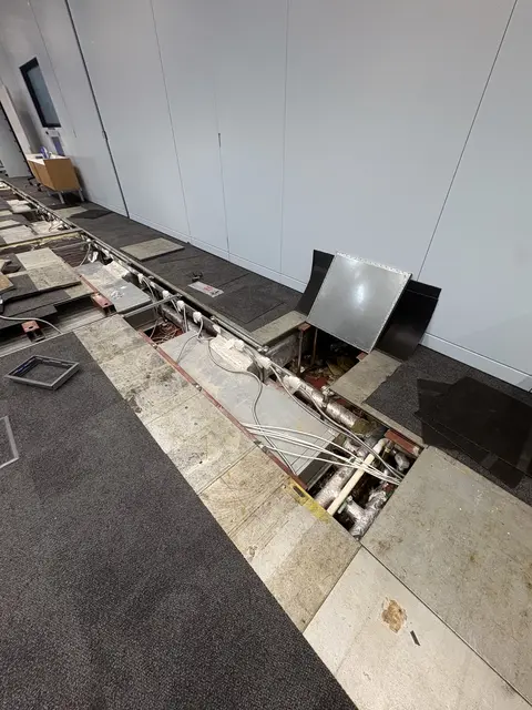 Raised-floor cabling and containment during an office fit-out in Hammersmith