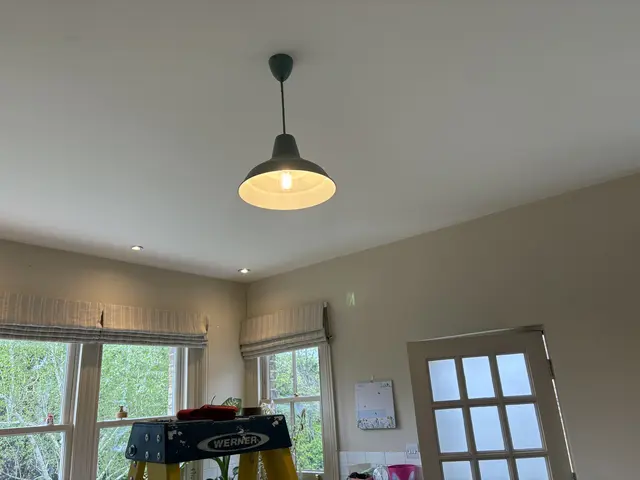 Industrial-style pendant light fitted in an Acton kitchen-diner