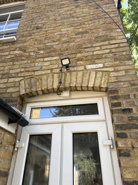 LED security floodlight installed above French doors in Chiswick