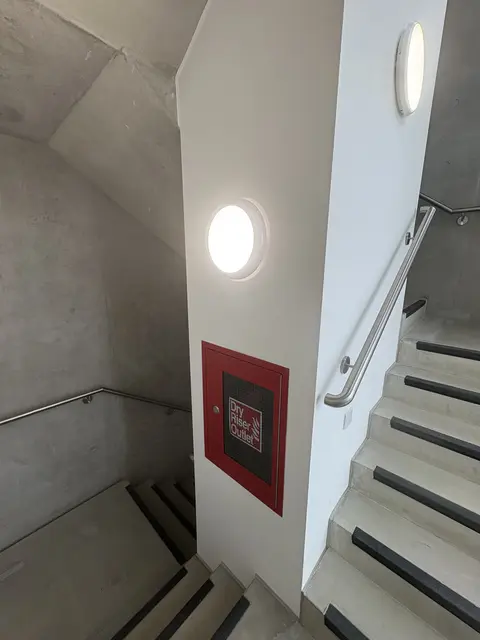 LED bulkhead lights installed in a Notting Hill communal stairwell